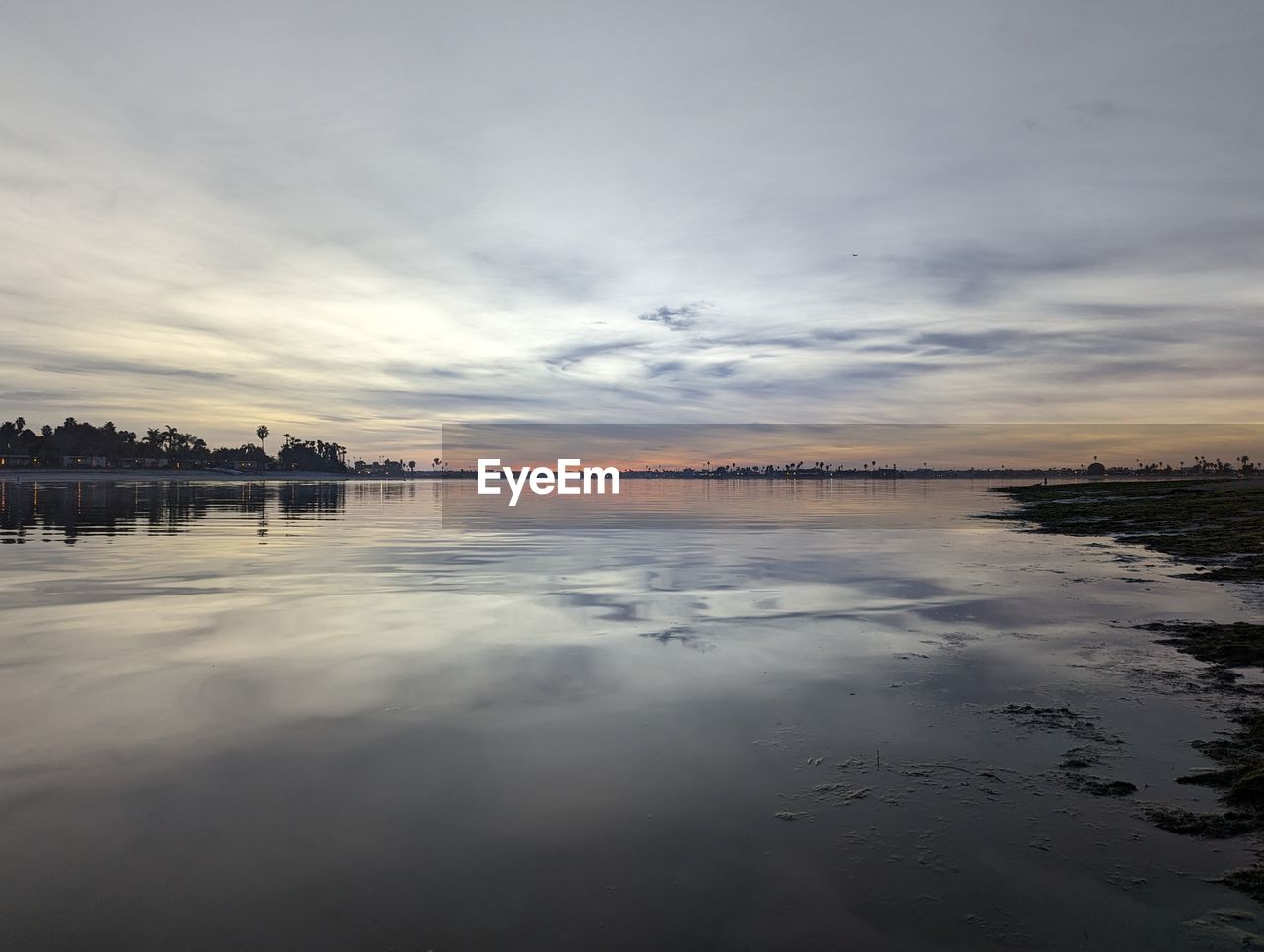 water, sky, reflection, cloud, morning, nature, sea, scenics - nature, dawn, beauty in nature, tranquility, environment, horizon, sunrise, landscape, land, shore, sunlight, travel destinations, beach, no people, tranquil scene, body of water, outdoors, wave, architecture, travel, ocean, coast, dramatic sky, tourism