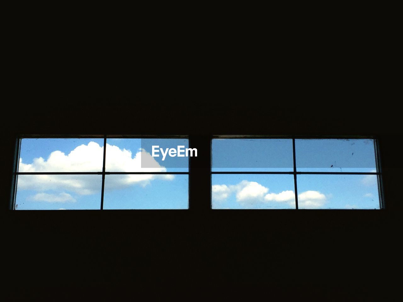 Low angle view of sky seen through window