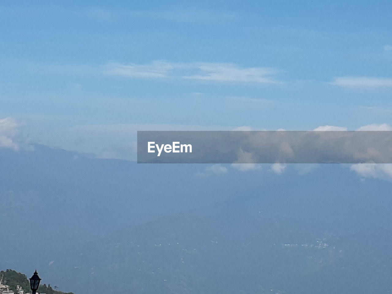 SCENIC VIEW OF CLOUDS OVER MOUNTAINS