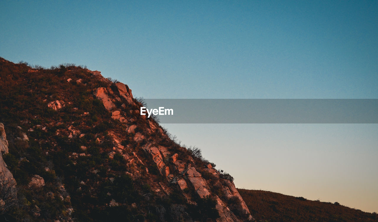 Scenic view of mountains against clear sky