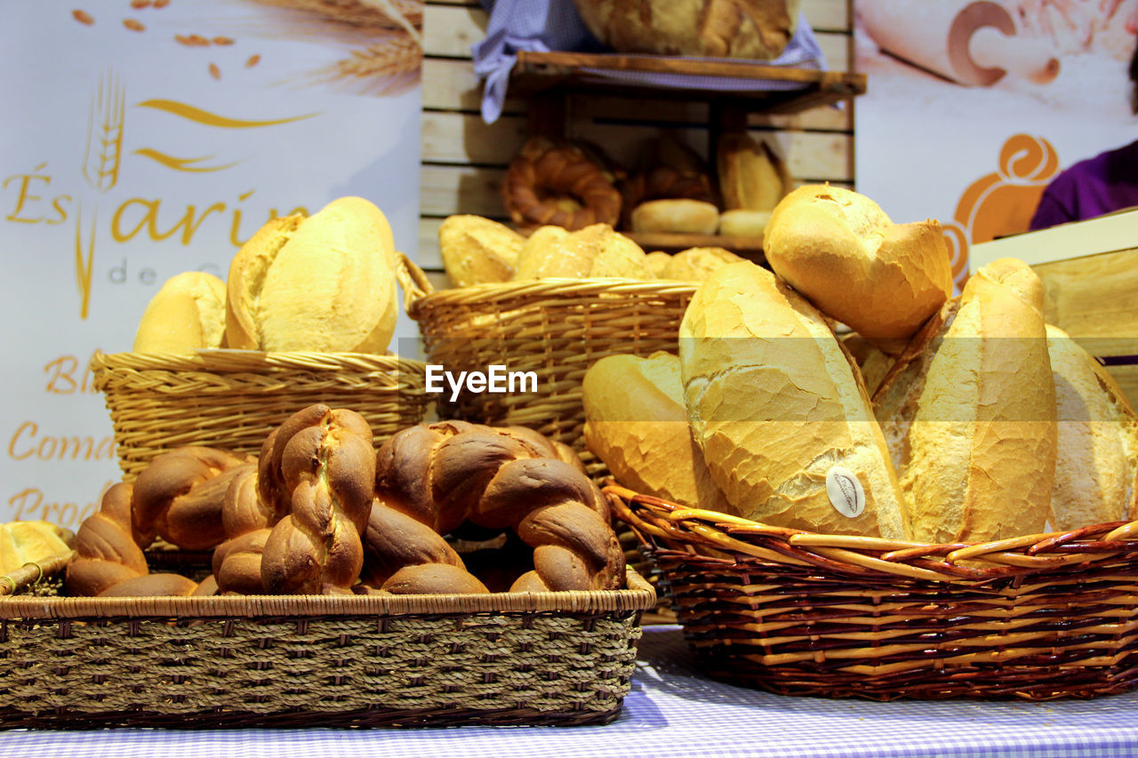 Various breads in basket on table