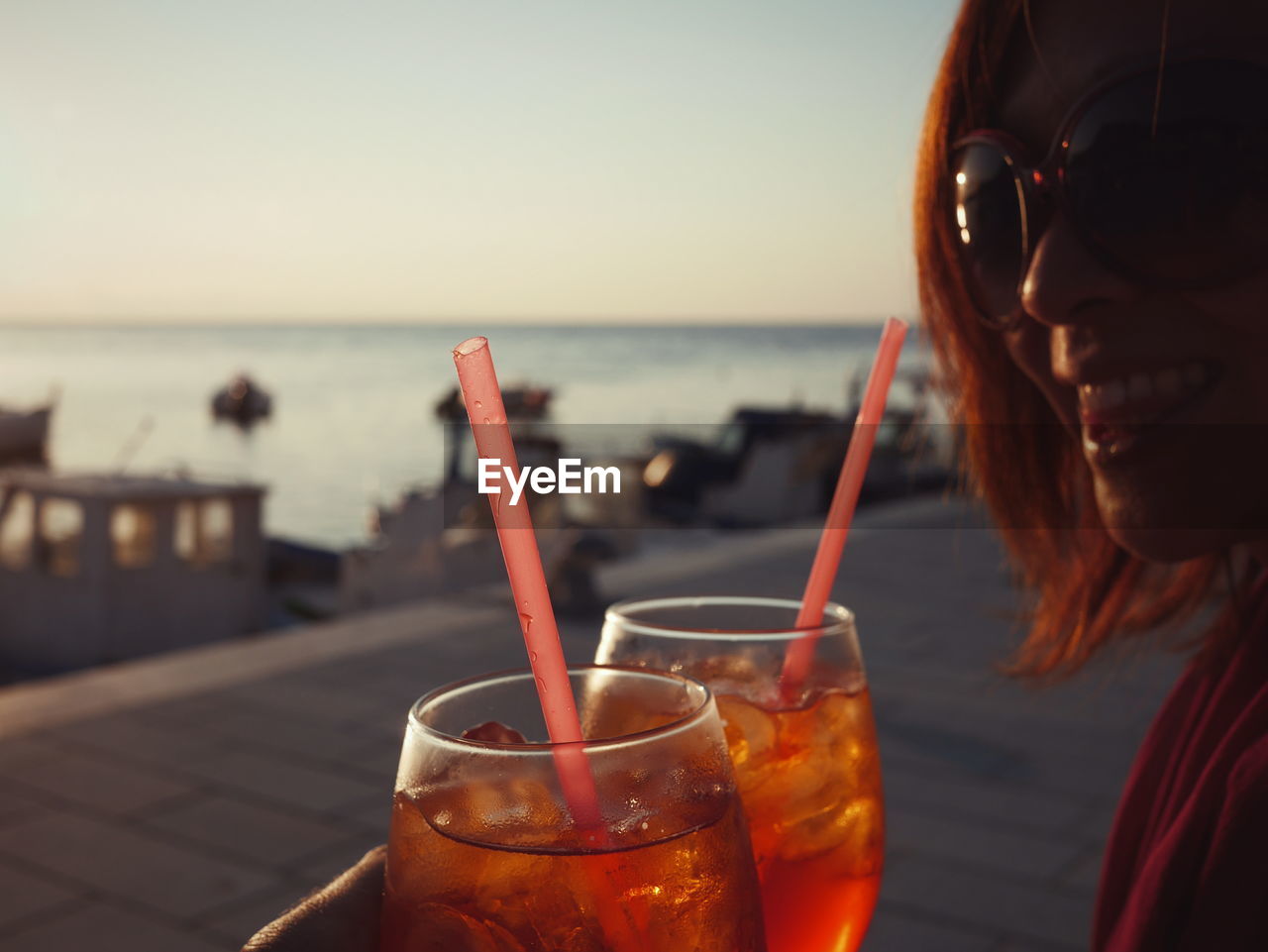 CLOSE-UP OF DRINK ON THE SEA