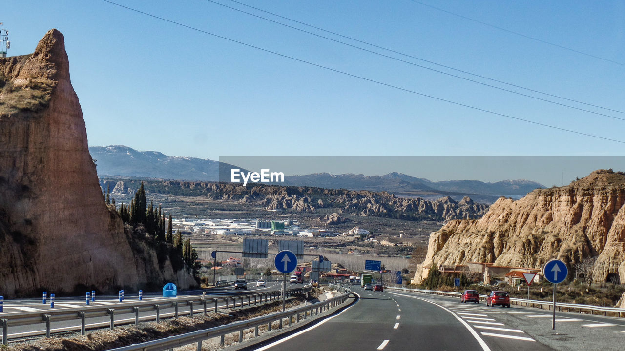 PANORAMIC VIEW OF ROAD AGAINST SKY