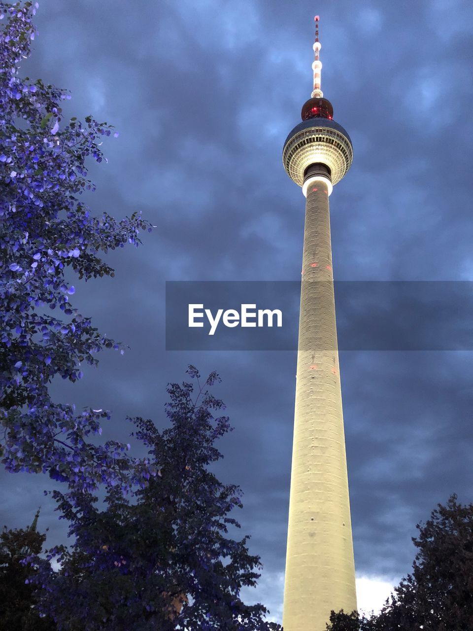 Low angle view of tower against cloudy sky