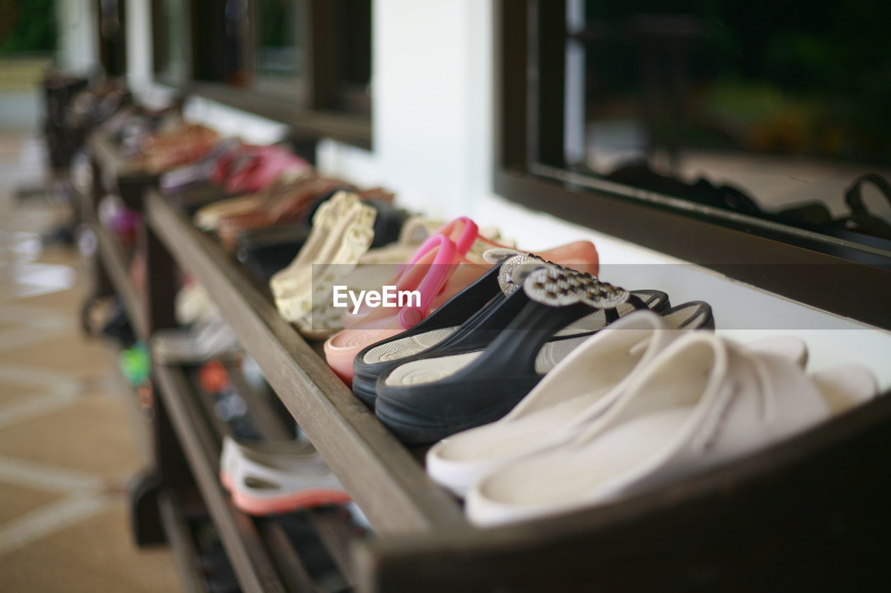HIGH ANGLE VIEW OF SHOES ON RACK