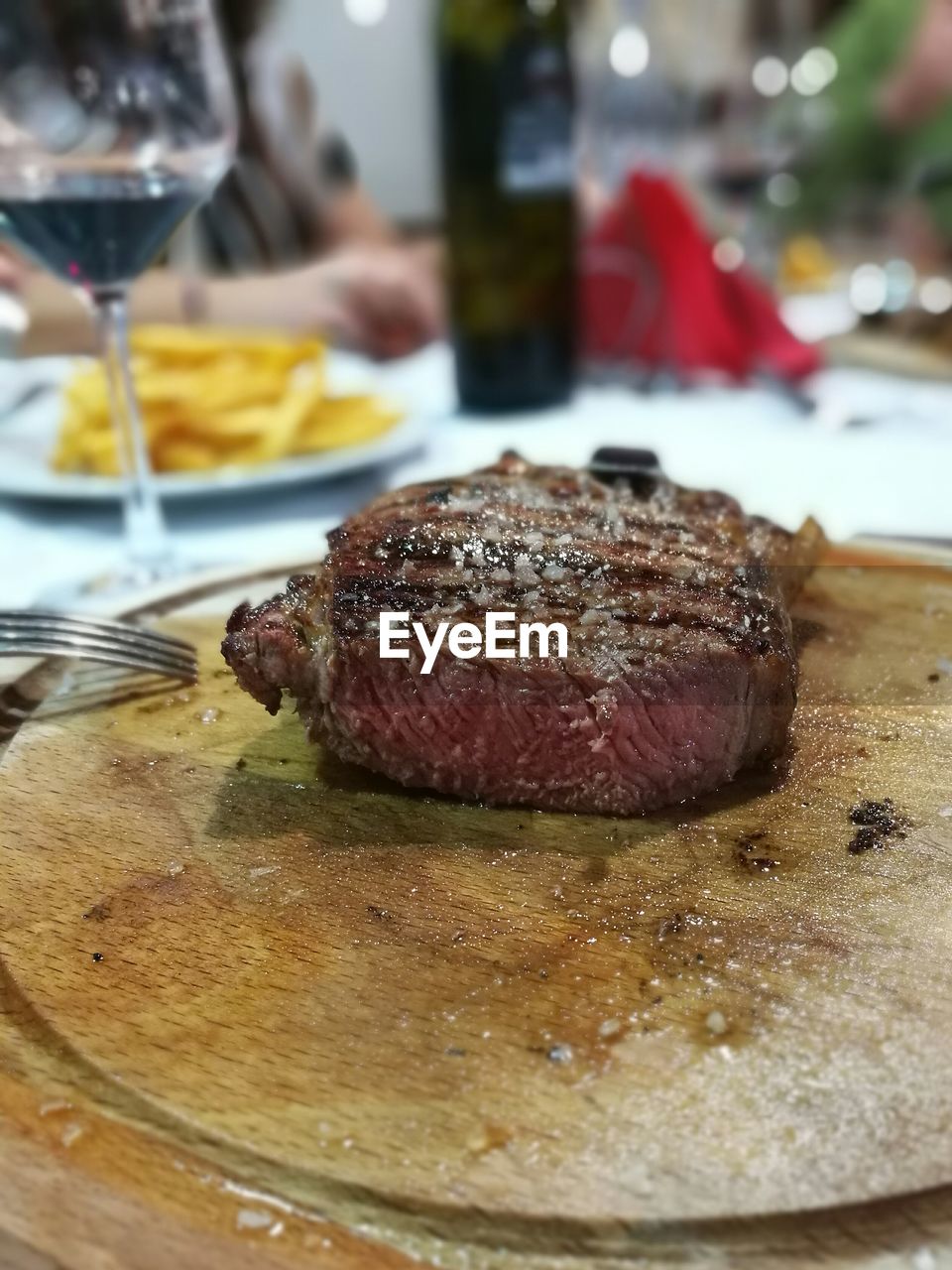 CLOSE-UP OF MEAT ON TABLE