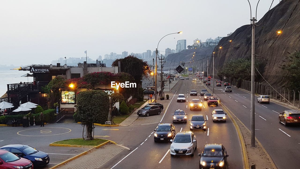 VEHICLES ON ROAD IN CITY