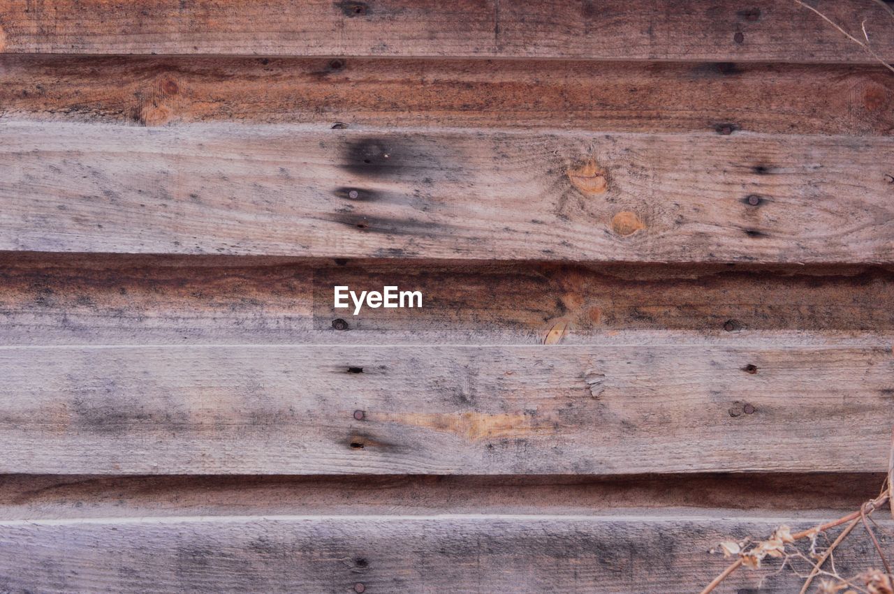 Full frame shot of weathered wooden wall