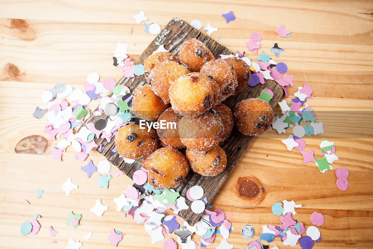 High angle view of food and confetti on table