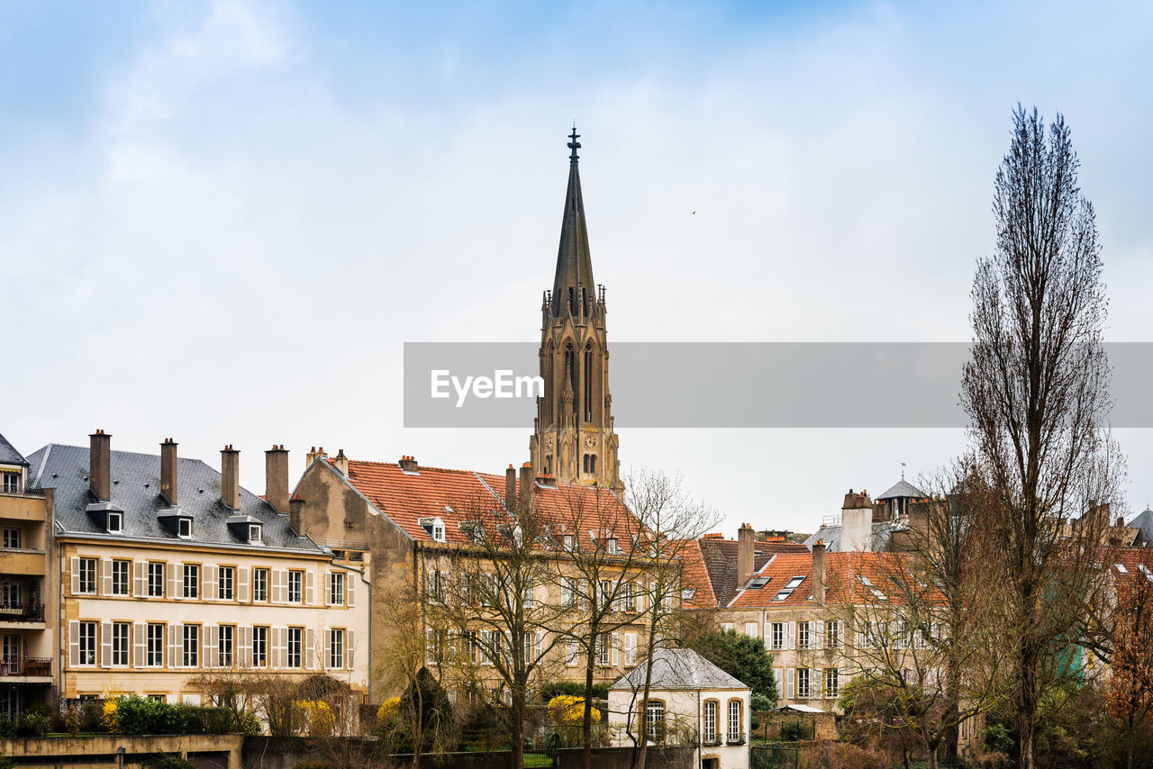 Low angle view of church against sky in town