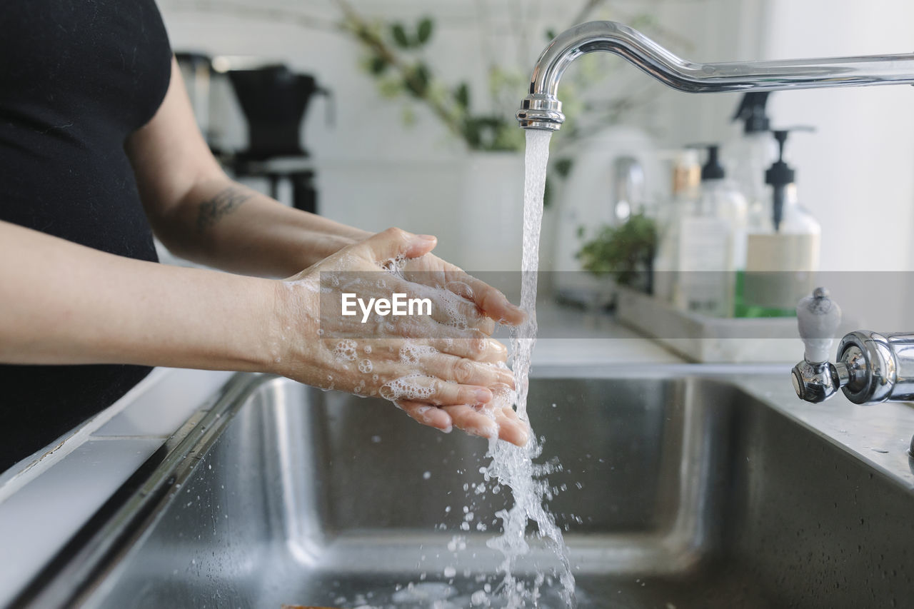 Woman washing her hands