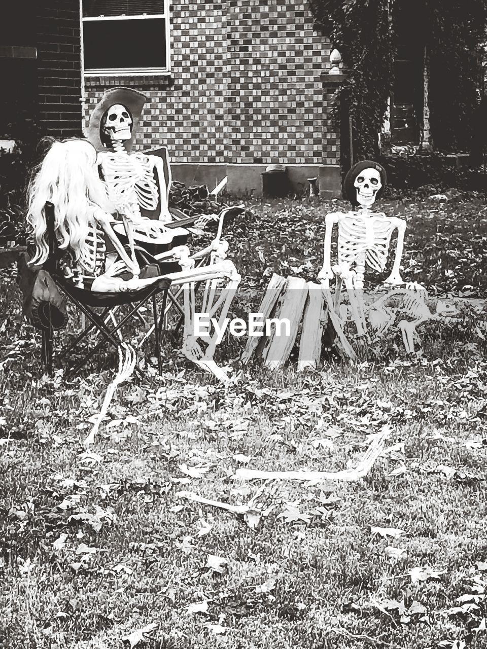 YOUNG WOMAN SITTING WITH TEXT AND PEOPLE