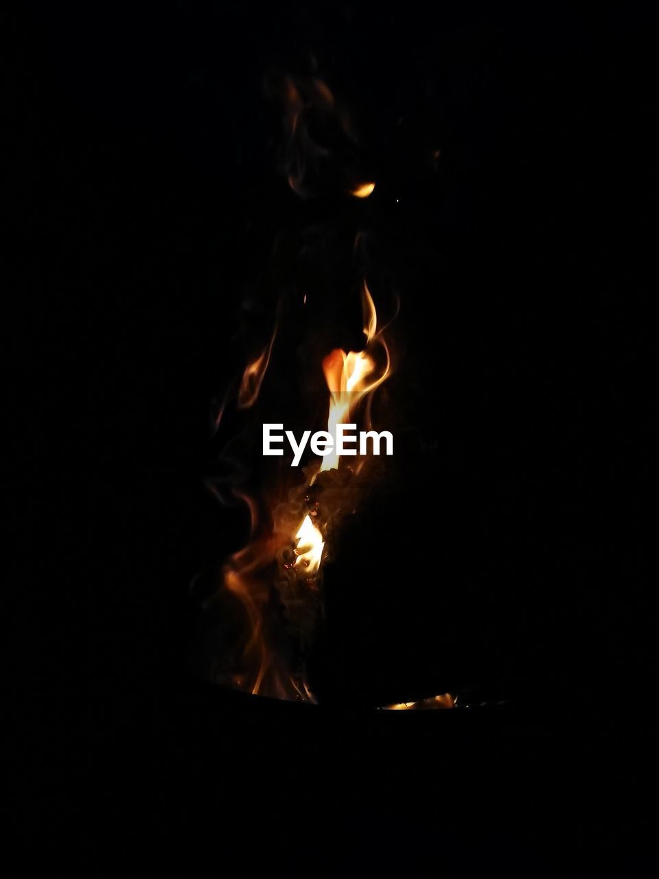 CLOSE-UP OF BONFIRE IN DARK