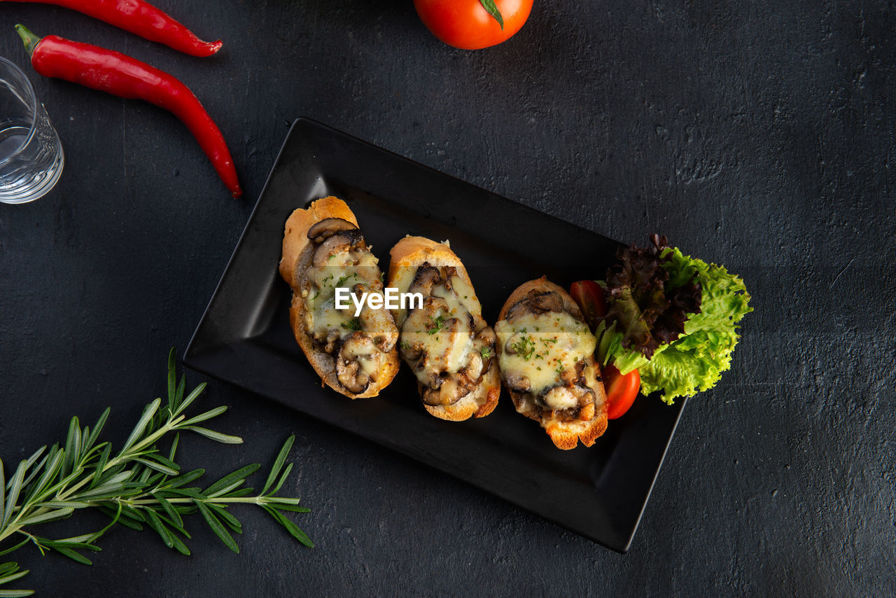 HIGH ANGLE VIEW OF VEGETABLES ON BARBECUE TABLE