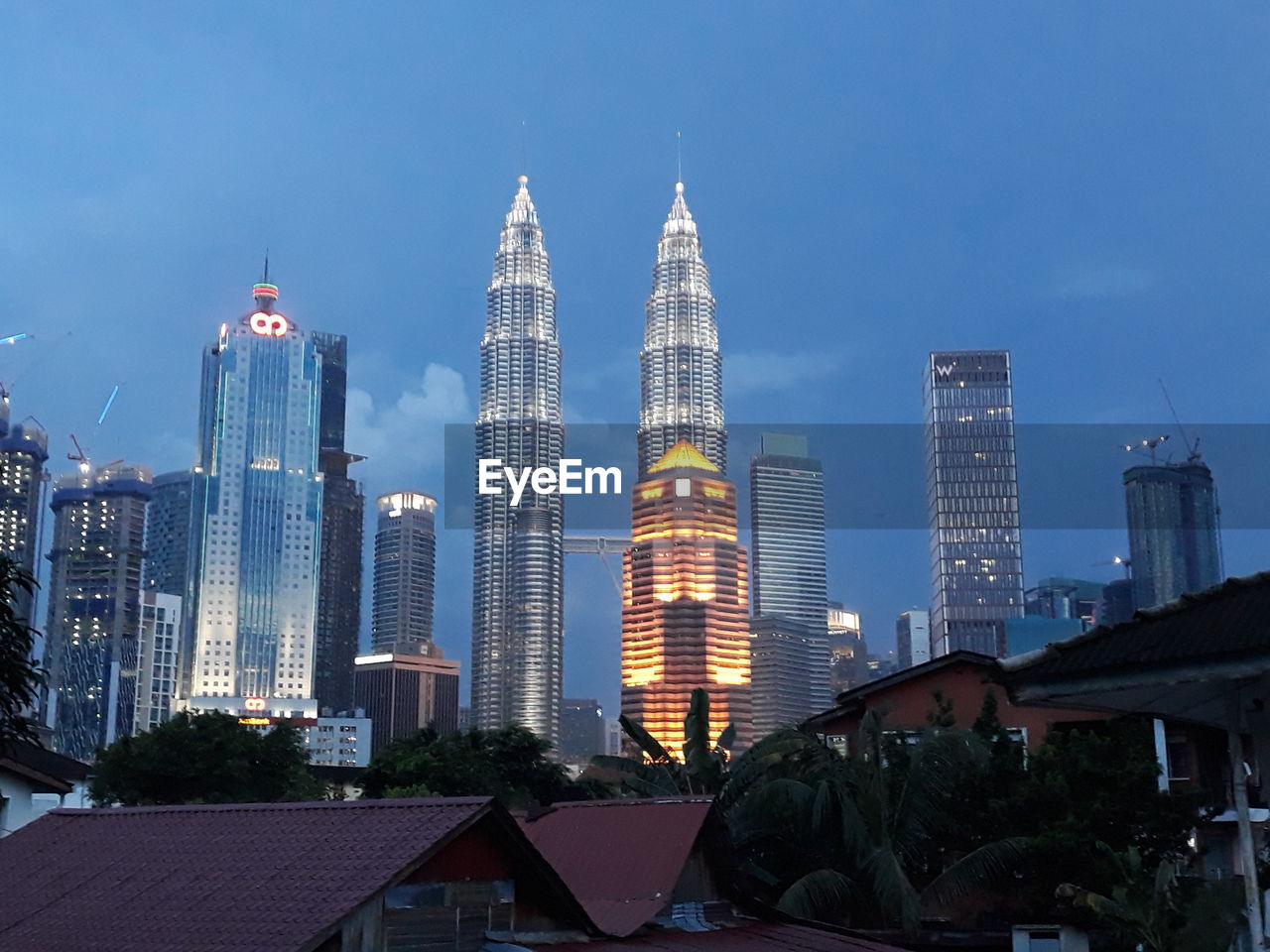 Modern buildings in city against sky