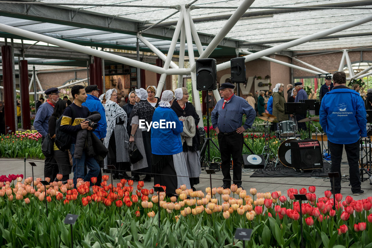 PEOPLE AT FLOWER MARKET