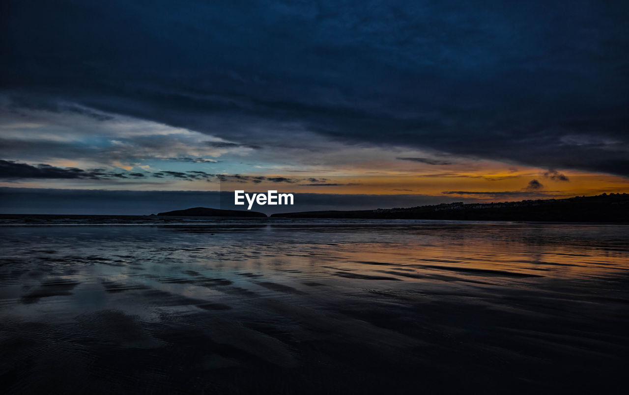 Scenic view of sea against sky at sunset