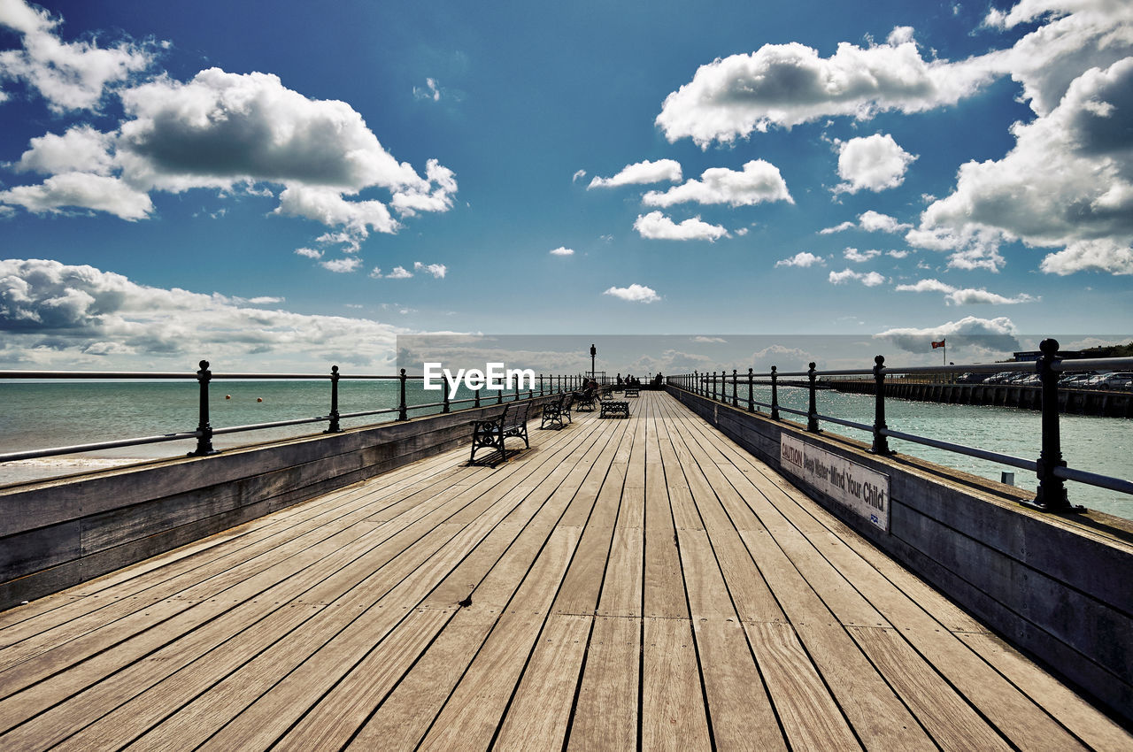 Pier over sea against sky