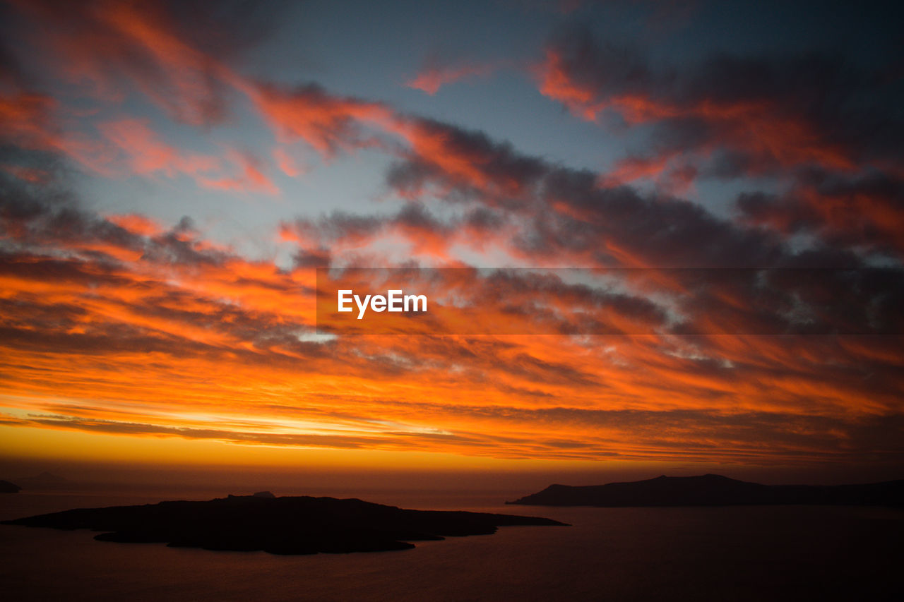 SCENIC VIEW OF DRAMATIC SKY DURING SUNSET