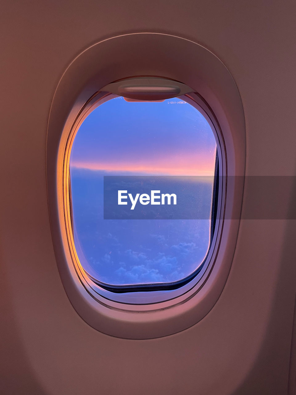 Directly below shot of sky seen through airplane window