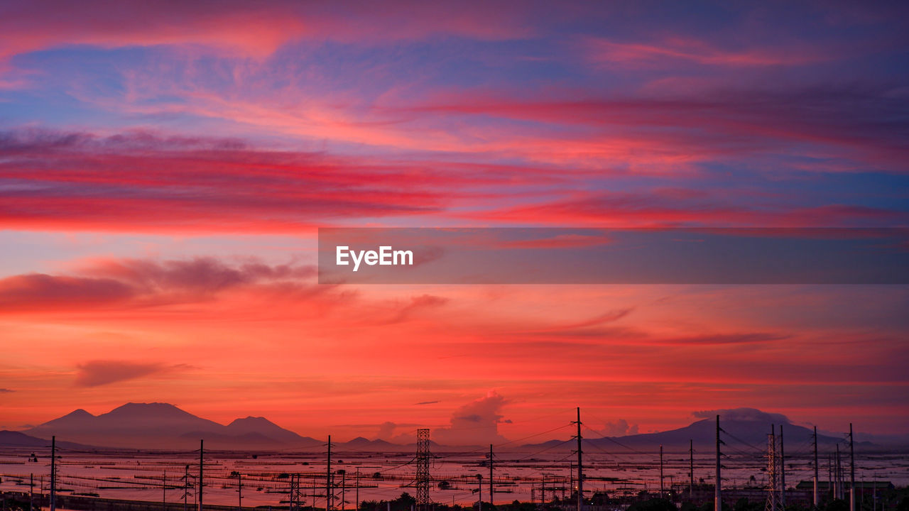 Scenic view of dramatic sky during sunrise