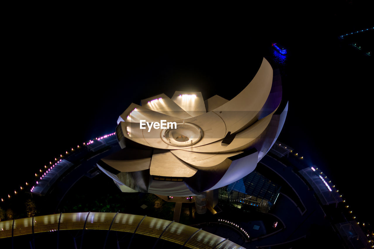 ILLUMINATED FERRIS WHEEL IN CITY AGAINST SKY AT NIGHT