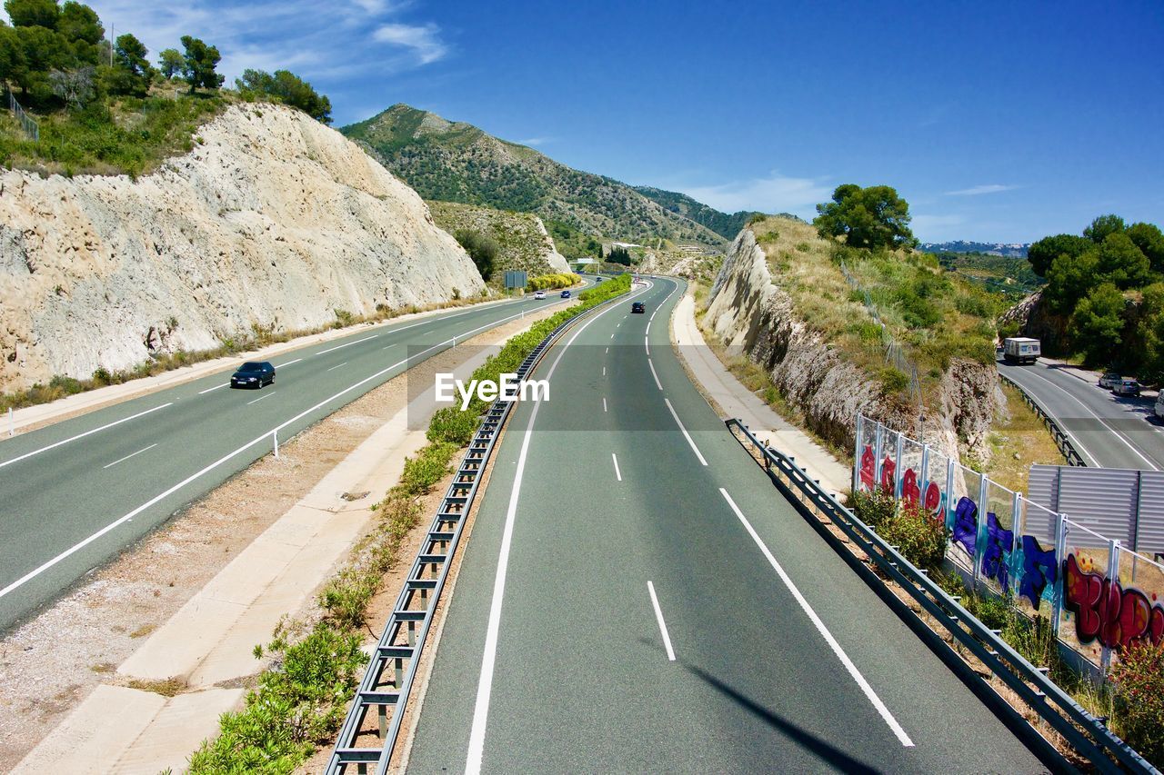 PANORAMIC VIEW OF ROAD AGAINST SKY