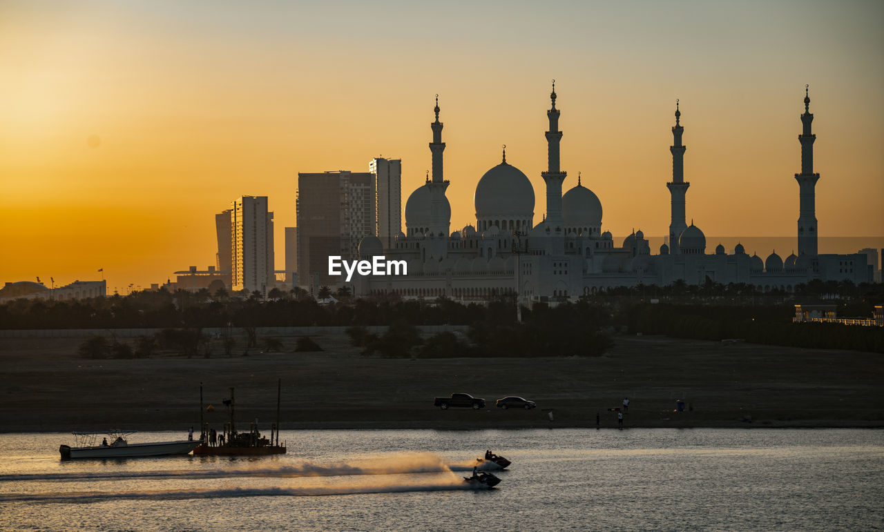 BUILDINGS IN CITY AT SUNSET