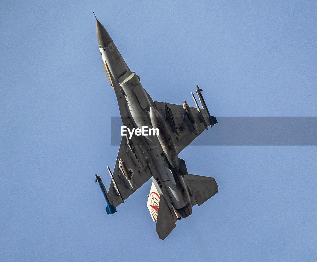 LOW ANGLE VIEW OF AIRPLANE FLYING IN SKY