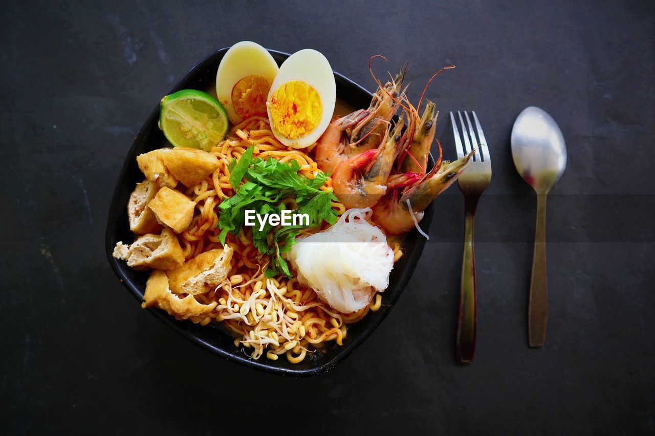 Laksa, laksa curry made from vermicelli, noodles, laksa served on bowl, isolated on white background