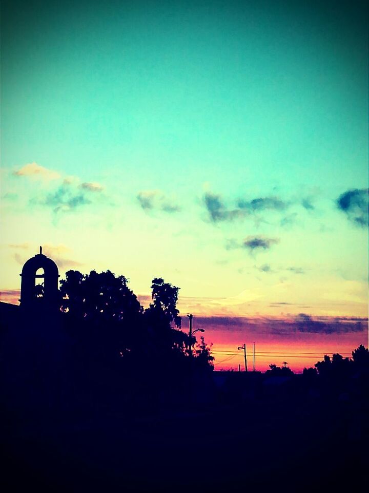 SILHOUETTE OF BUILDING AT SUNSET