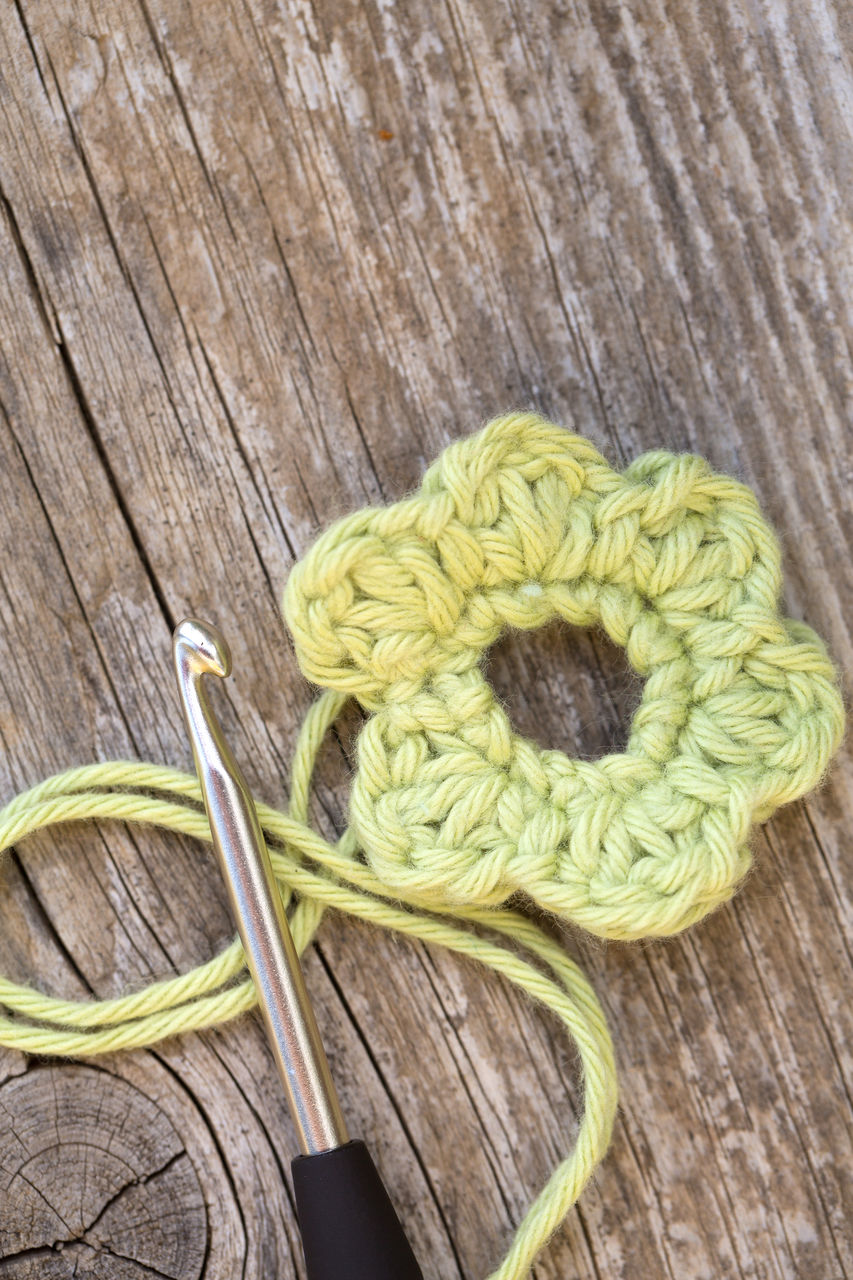 Close-up of woolen flower on table