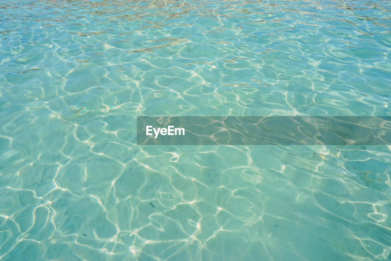 FULL FRAME SHOT OF WATER IN SWIMMING POOL