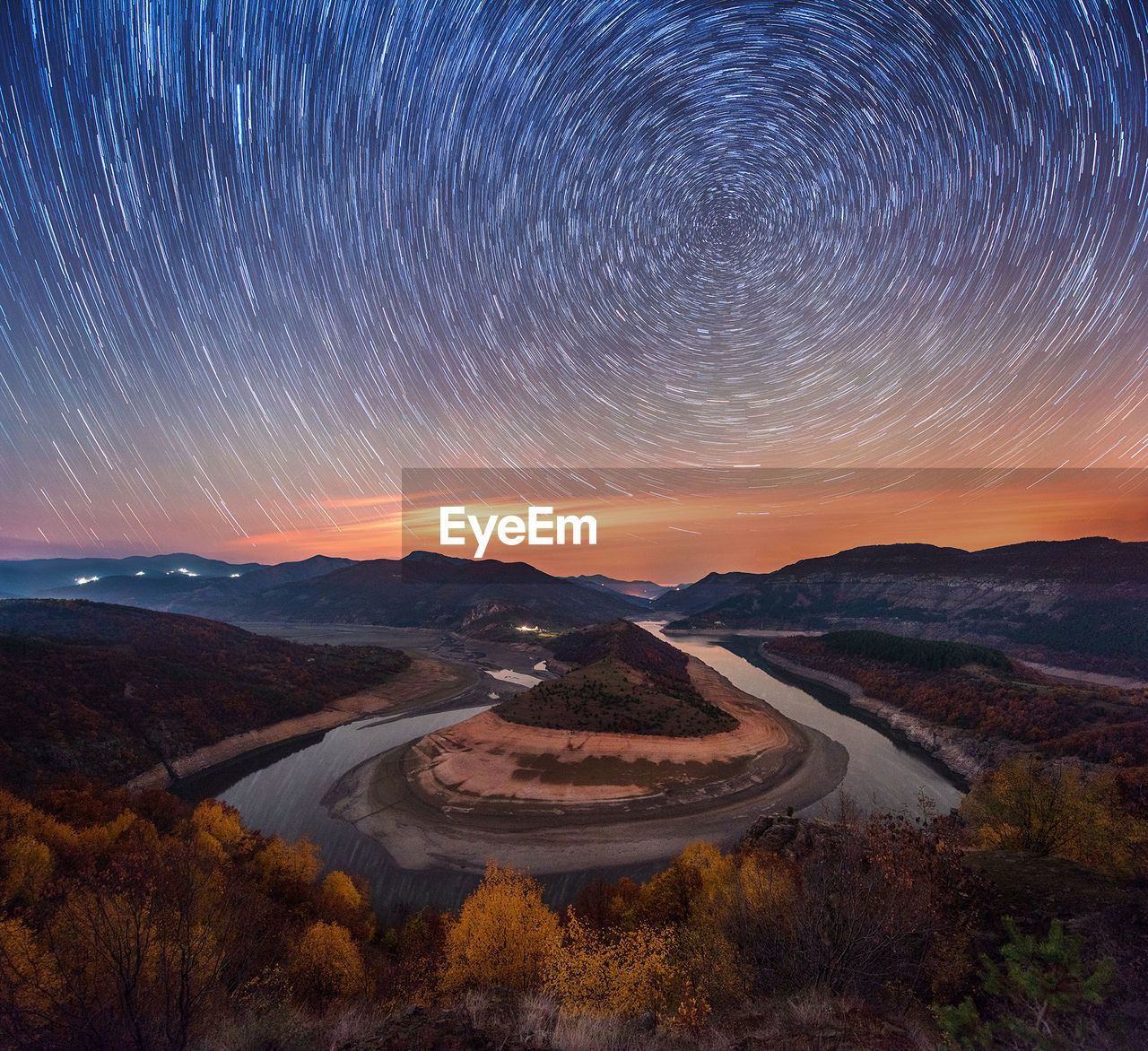 Scenic view of landscape against sky at night