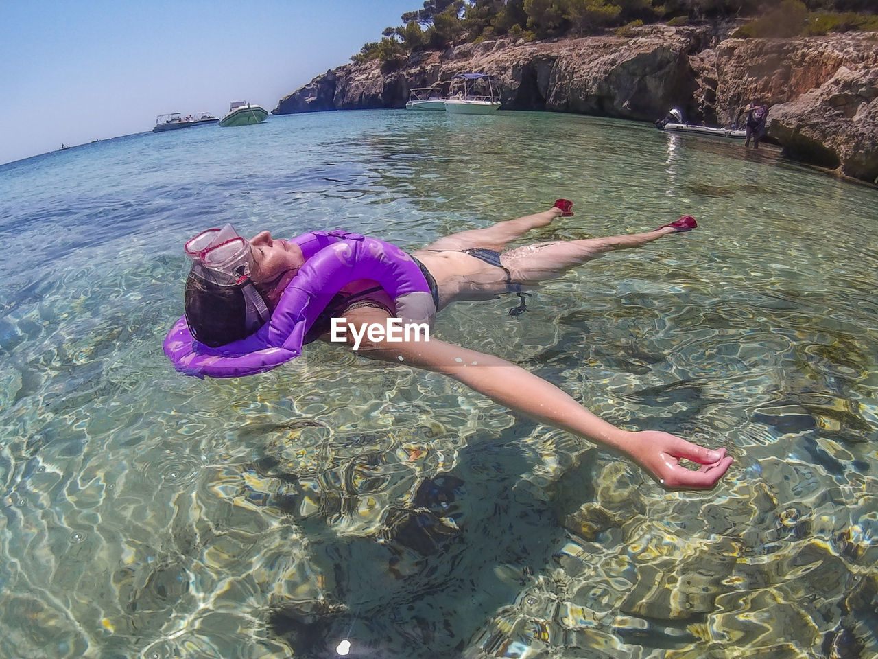 Young woman with swimming in sea