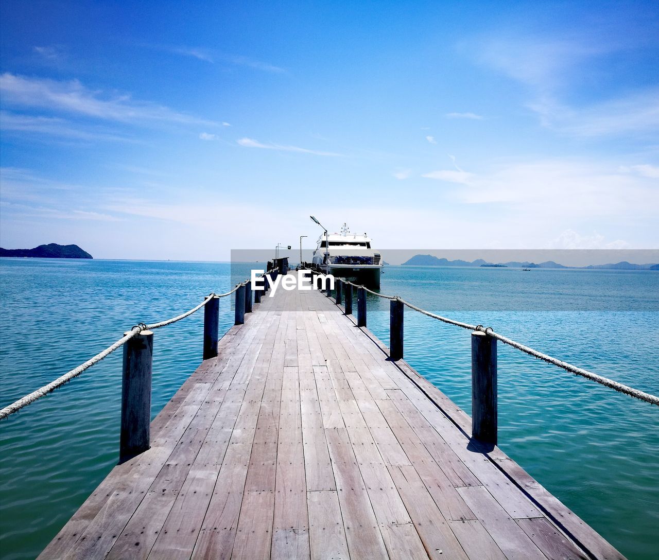 Pier over sea against sky