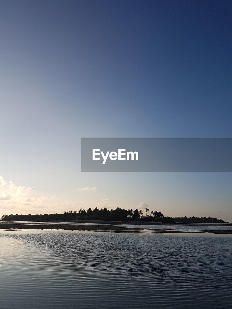 VIEW OF LAKE AGAINST CLEAR BLUE SKY