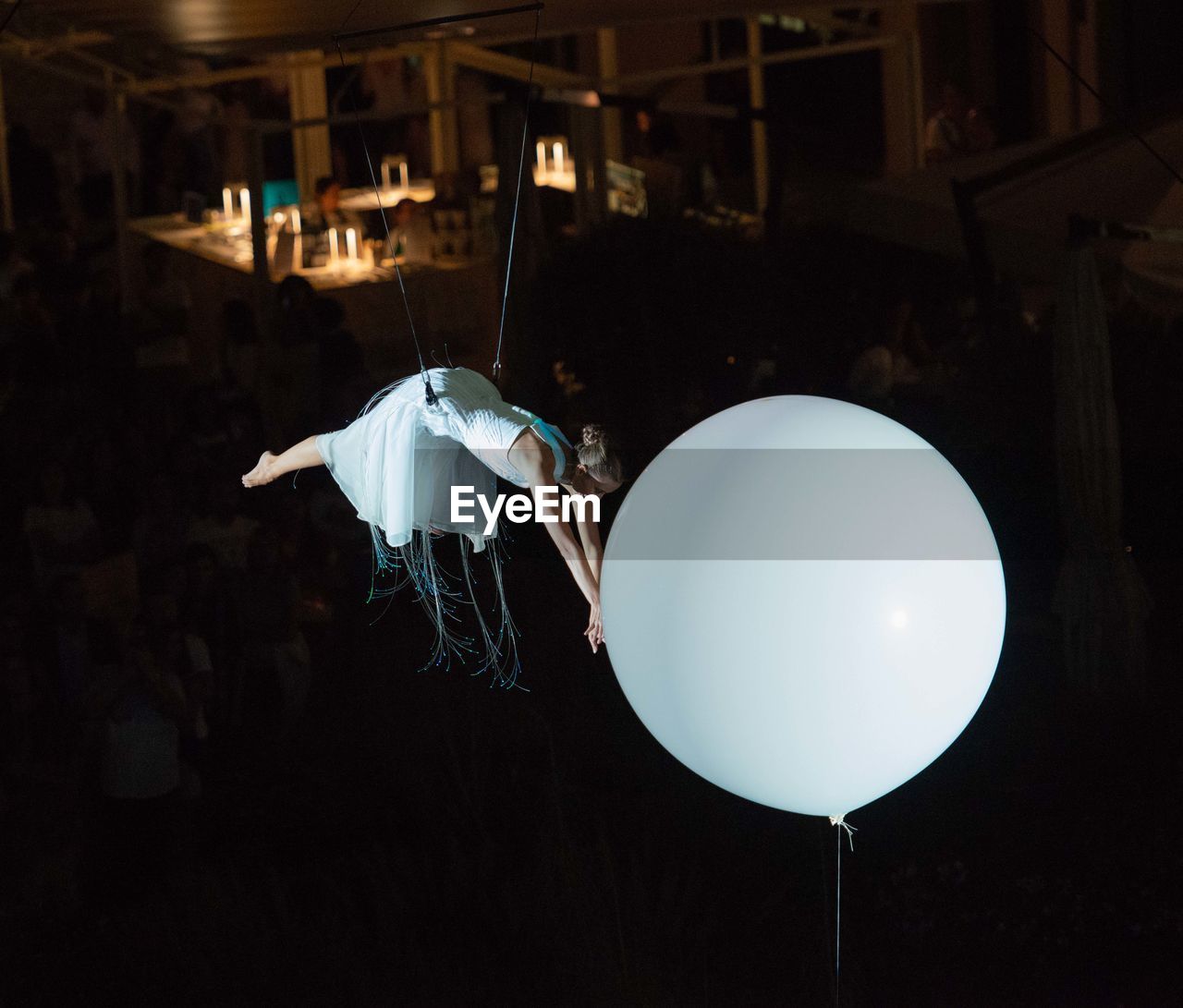 Close-up of balloons against dark sky