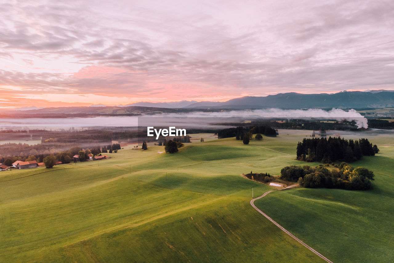 Scenic view of landscape against sky during sunset