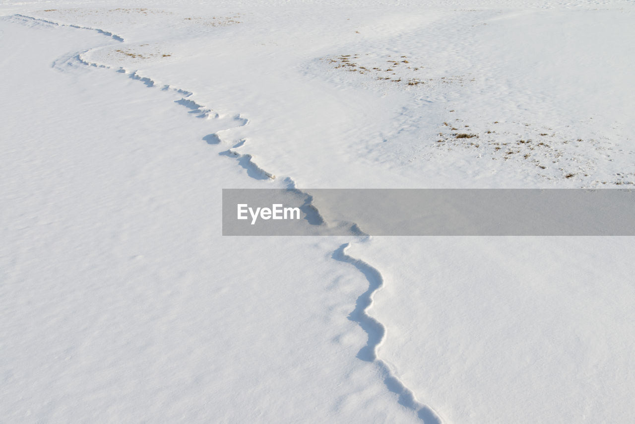 High angle view of ice tracks on snow