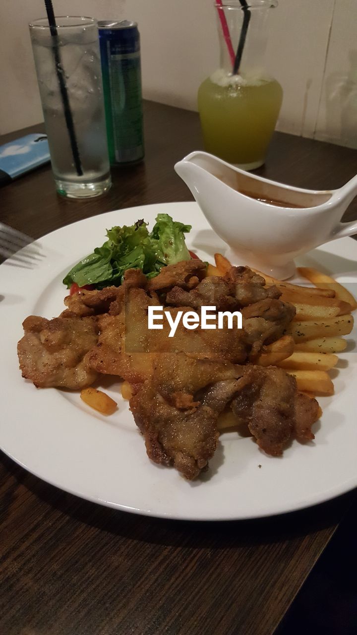 CLOSE-UP OF SERVED FOOD ON TABLE