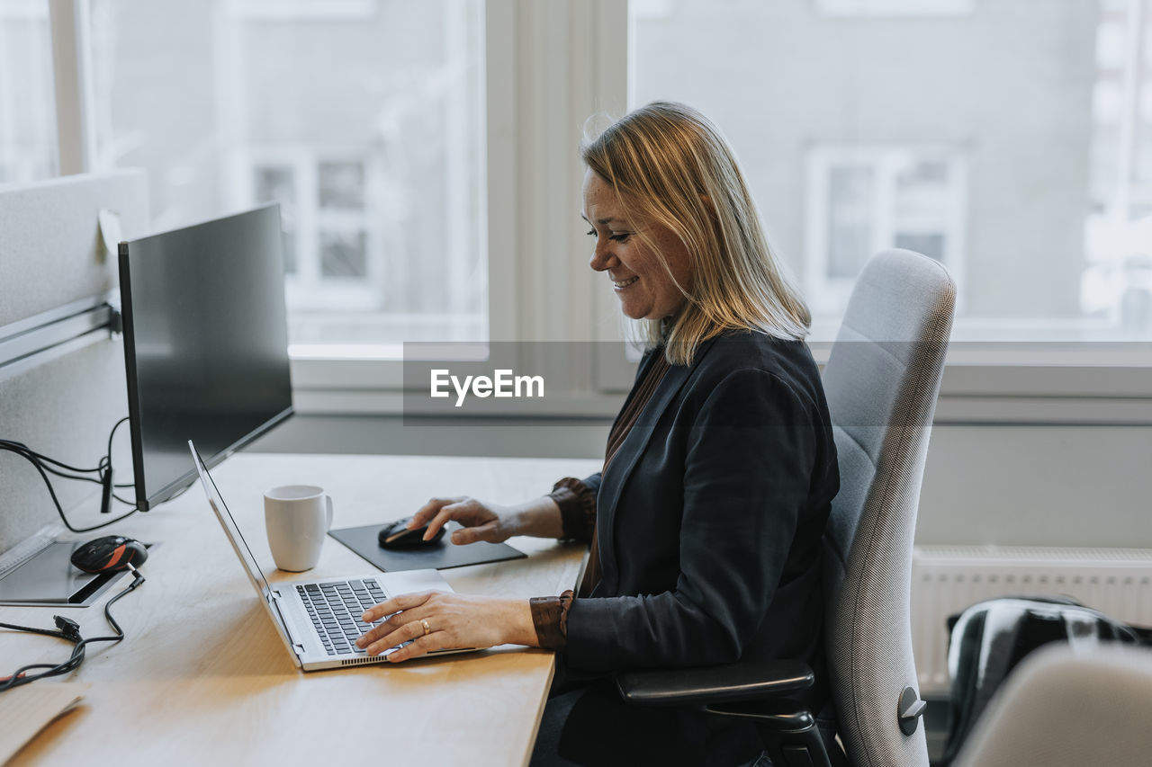 Smiling woman working in office