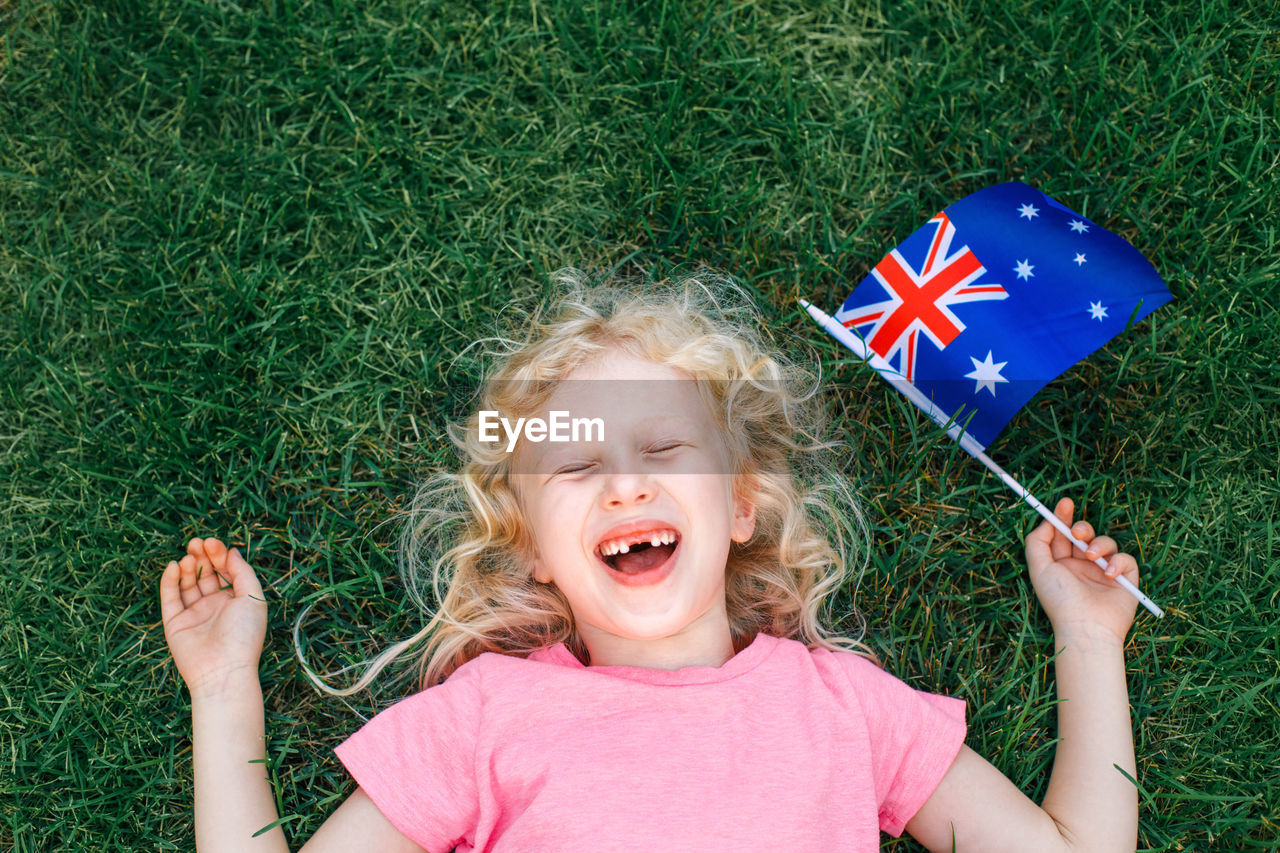 Caucasian girl holding australian flag. kid citizen celebrating australia day holiday 