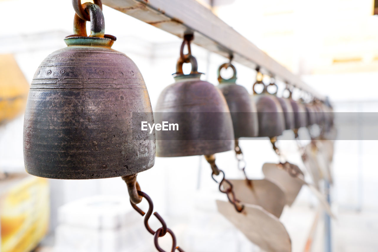 Close-up of bells hanging 