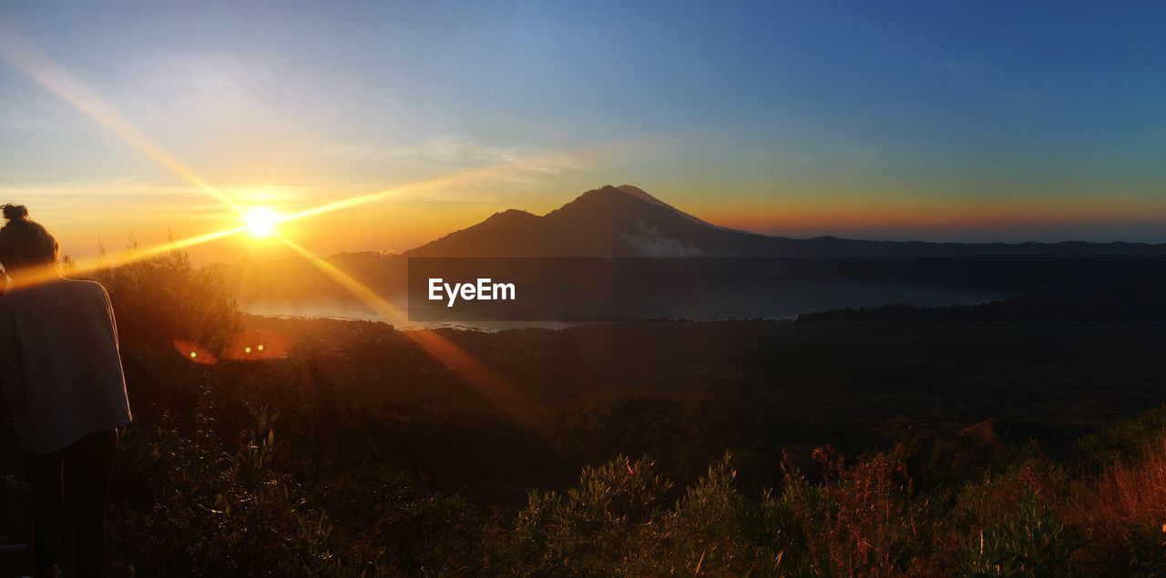 SCENIC VIEW OF LANDSCAPE AGAINST SKY AT SUNSET