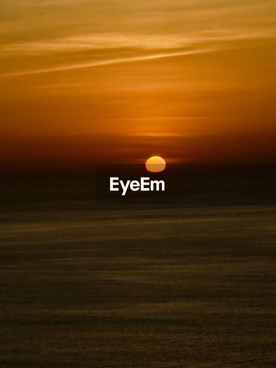 sky, sunset, beauty in nature, horizon, scenics - nature, tranquility, tranquil scene, nature, orange color, sea, no people, sunlight, sun, dawn, idyllic, afterglow, cloud, dramatic sky, water, environment, outdoors, land, non-urban scene, landscape, evening, ocean, horizon over water, circle, moon