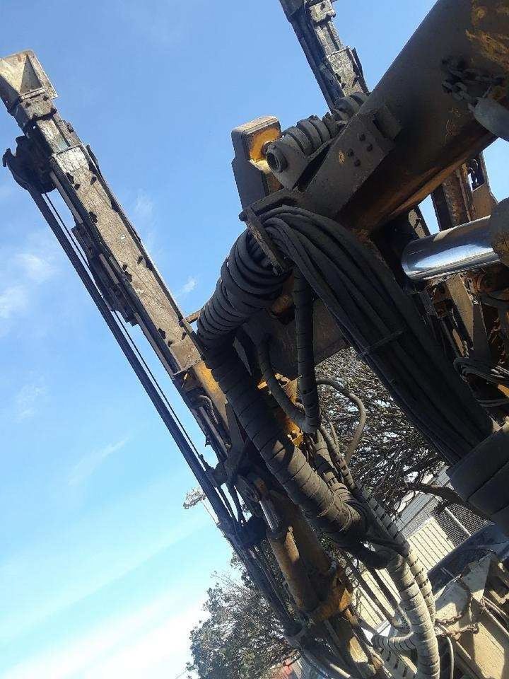 LOW ANGLE VIEW OF ABANDONED MACHINE AGAINST SKY