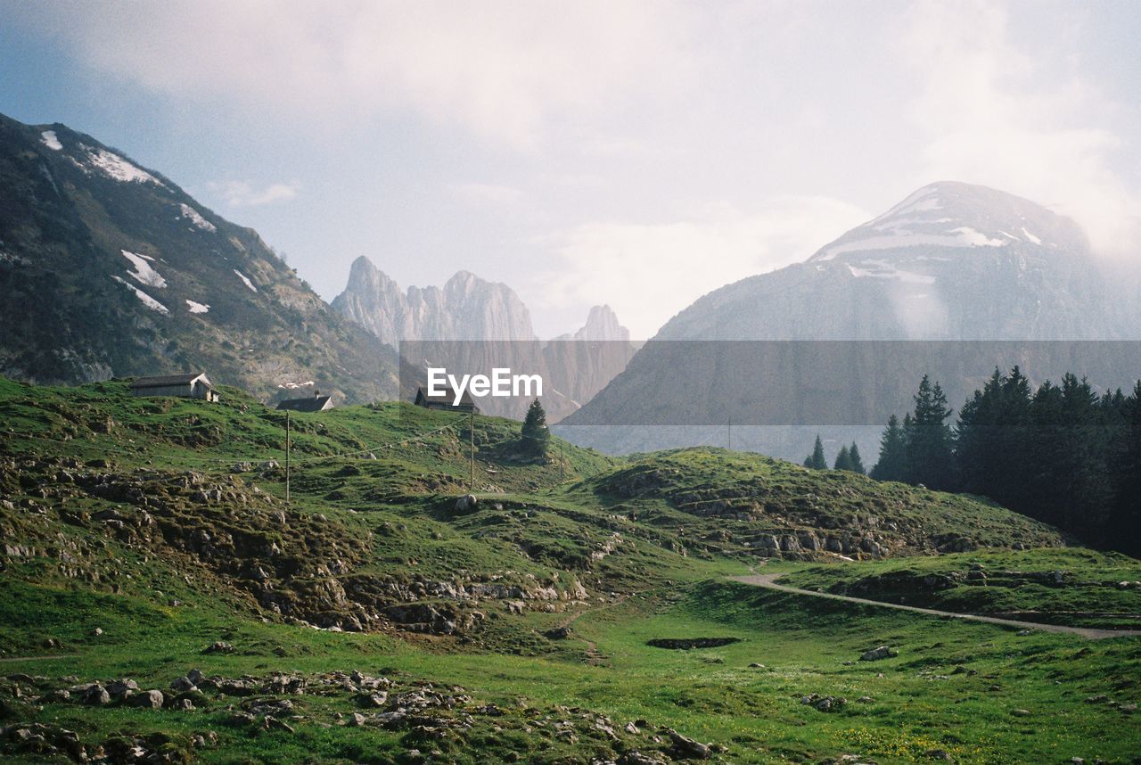 Scenic view of mountains against sky in the swiss alps in early summer. shot on 35mm film. 