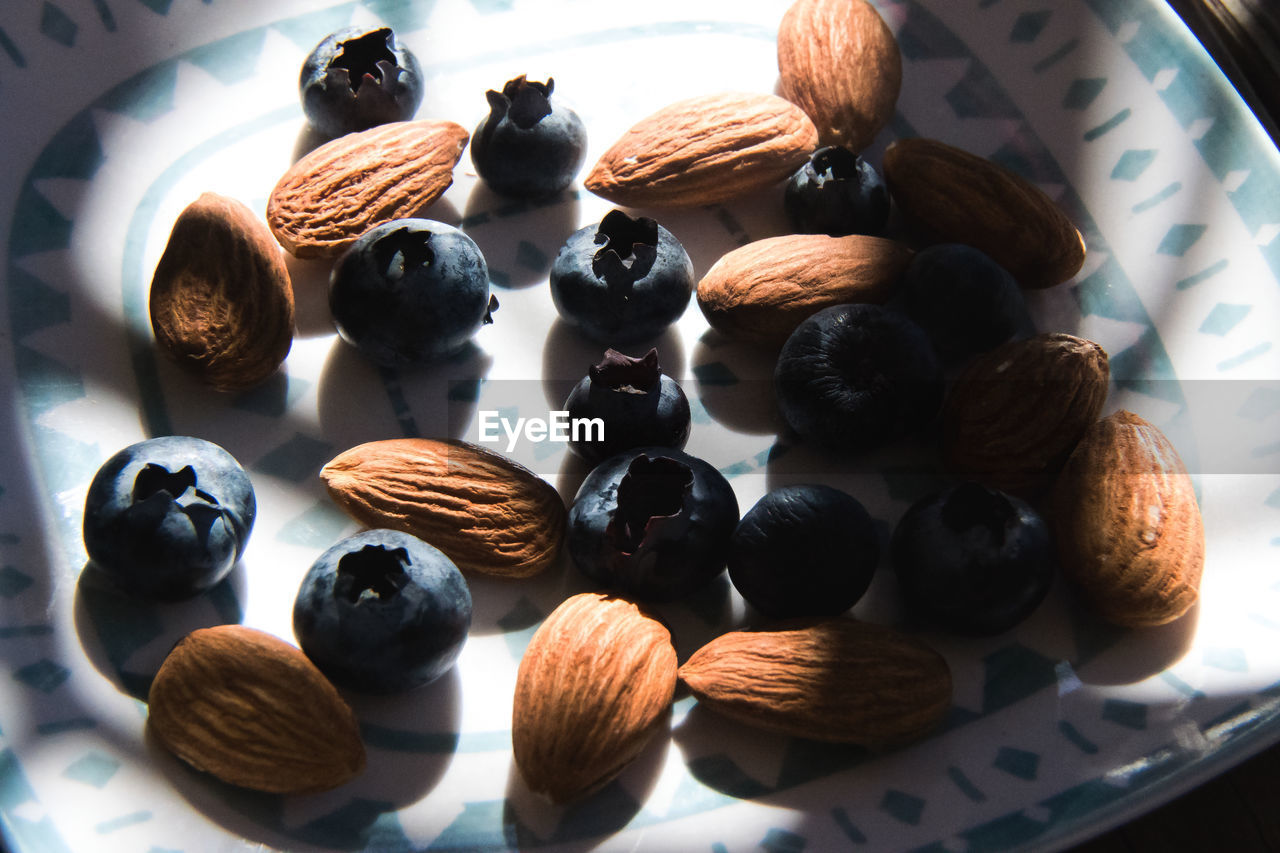 Close-up of almonds and blueberries on plate