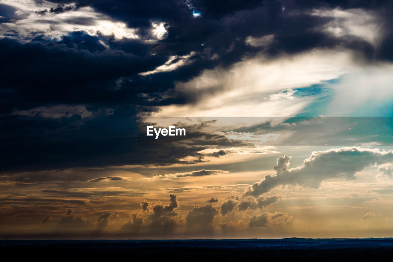 Scenic view of sea against dramatic sky